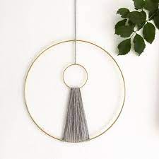 The wall decor features gold or silver metal with acrylic beads at the end. Minimalist Macrame Wall Hanging Grey And Gold Macrame Wall Etsy Bohemian Wall Decor Circle Macrame Wall Hanging Diy