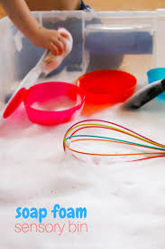 Dust in a little glitter for better visibility. Soap Foam Sensory Bin In The Kids Kitchen