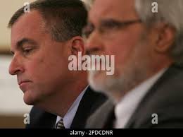 Tom Noe, left, is flanked by his attorney Jon Richardson during his court  hearing at the Lucas County Courthouse, in Toledo, Ohio, Monday, Feb. 13,  2006. Prosecutors have filed a 53-count indictment