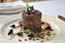 That bubbling and hissing is the water in the meat turning to steam. Steak Wikipedia