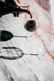 Red Wine On A Pink Marbled Background Pour Shot Editorial Stylist Creativedirector Artdirection Melbourne Bra Wine Photography Pouring Wine Wine Drinks