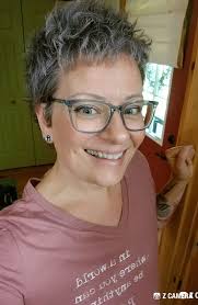 After a year of cancer treatments. Happy to have my hair back even if it's  gray! This is 67