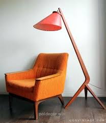 An orange mid century modern armchair. 1960 S Mid Century Danish Modern Teak Lounge Chair Orange Yellow Chairs R Poll Decor Vintage Mid Century Furniture Mid Century Furniture Mid Century Chair