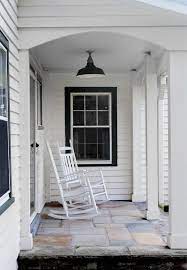Make the yellow white and the white stays white ~ just a fresh coat. This Tennessee Farmhouse Is The Epitome Of Southern Comfort Black Trim Exterior House White Exterior Houses Window Trim Exterior