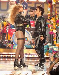 I think the perspective of bruno mars being closer to the camera further exaggerates the height difference. 31 Times Bruno Mars Was The Shortest Person In The Room