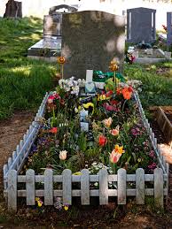 Leaving flowers on the graves of loved ones is a special practice. File City Of London Cemetery Picket Fence Grave With Plastic Flower Bed 1 Jpg Wikimedia Commons