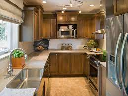 Kitchen track lighting is no longer stuck in the dark ages. Transitional Galley Kitchen With Brown Cabinets Hgtv