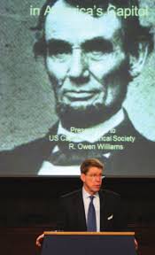 north cheek block has a larger-than-life frontiersman protecting his wife  and child by overpowering a semi- nude male native war