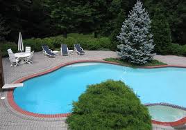 Numerous options exist for serviceable pool decking: How To Effectively Use Brick Around In Ground Pools Watsontown Brick Company