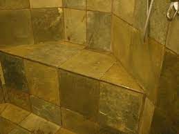 To clean shower grout with white vinegar, mix one part vinegar to two parts water and scrub with a stiff brush. Pin By Holly Campbell On For The Home Slate Shower Cleaning Shower Tiles Slate Tile Shower