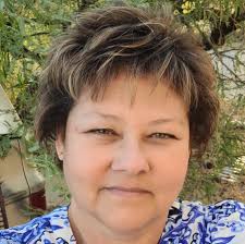 What climbing plants with flowers can withstand direct sun for a gazebo?