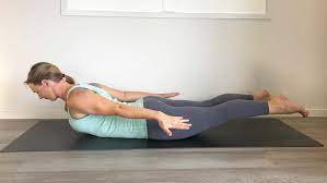 Woman doing ashtanga vinyasa yoga asana tadasana samasthiti yoga posture on beach. 10 Simple Yoga Poses That Help Everyone At Any Age