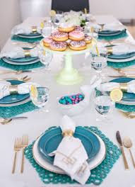 Gather fresh blooms, vibrant moss, glass vases, and colorful wooden eggs. Turquoise And White Easter Lunch Table Setting