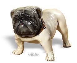 They are described as small, silent dogs with pointed noses like a schipperke, which are seen following individuals in the weeks before their death. White Bulldog Bulldog Figurine Bulldog Statue Dog Statue