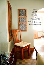 Creating this farmhouse style wall decor by using an old double window frame with a boxwood wreath old windows decorating a blank wall. Diy Rustic Metal Tile Wall Decor Designed Decor