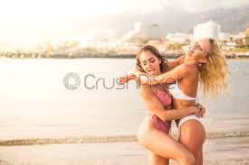 Young punk person at a cafe young and lovely gender blend woman, enjoying a cup of coffee at the cafe. Cheerful Couple Of Beautiful Girls Have Fun Together At The Stock Photo Crushpixel