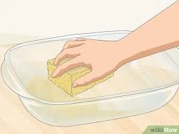 Rub it all over the grease spots. 3 Simple Ways To Clean Baked On Grease Off Glass Dishes Wikihow