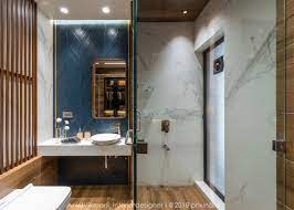 The bathroom has both a shower and a bathtub, with countertops and a. Top 5 Small Bathroom Interiors Design Ideas The Architects Diary