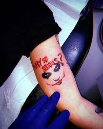 The Contrast Between The Deep Red And Black In This Joker Why So Serious Tattoo Makes A Bold And Daring Joker Tattoo Design Why So Serious Tattoo Joker Tattoo