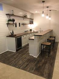 Basement Flooring Ideas Choosing The Right Flooring Has Different Rules In A Basement Than It Does In In 2020 Basement Kitchenette Basement Design Basement Apartment