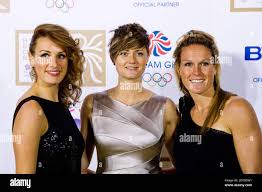 l-r) Ashleigh Ball, Sally Walton and Christa Cullen attending the British  Olympic Ball, at the Grosvenor House hotel in Mayfair, London Stock Photo