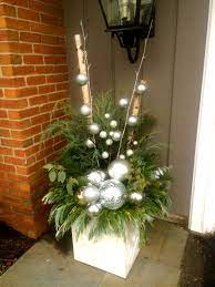 A Modern Twist On Holiday Planters Christmas Urns Holiday Planter Outdoor Holiday Planters