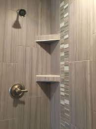 Custom Tiled Shower In A 12x24 Porcelain Tile Install 1 3 Staggered Vertically With A Stone And Glass Mosaic Ac Shower Tile Glass Tile Shower Floor Tile Design
