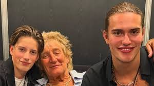 Sir Rod Stewart poses for a sweet snap with his sons Alastair, 19, and  Aiden, 14, as Penny gushes over 'my boys'