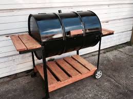 Inexpensive fire pit made from a 55 gallon drum, a grate from northern tool and blocks from lowe's. Barrel Bbq Pits Www Macj Com Br
