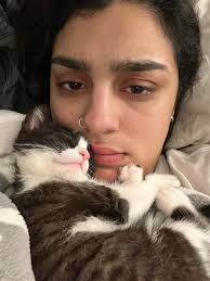 Dear Diary, My humans betrayed me today. I was getting all of the cuddles  when that stoopid cat waltzed over and kicked me out of my spot. The humans  didn't even stop