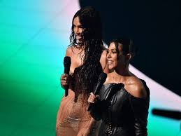 The reality star turned mommy cover . Megan Fox Poses With Kourtney Kardashian For A New Skims Campaign