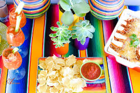 We put on an epic mexican dinner party for a few of my closest friends equipped with a guacamole station, flavorful tacos, pitchers of margaritas and a modern tablescape save this pin for your next mexican dinner party inspiration! Easy Chicken Enchiladas Plus Mexican Fiesta Tablescape An Alli Event