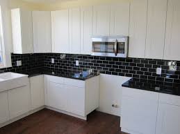 Vinyl tile is a classic when it comes to black and white flooring — and for good reason. Interior Of Black White Kitchen Black Tile In The Kitchen Contrast Interior