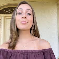 My sister all dressed up taking pictures showing attitude