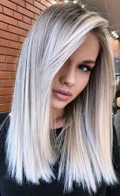 This style is designed to sit right below the shoulders, and the hair is swept to one side to drastically emphasize the length of the hair. Picture Of Beautiful Long Blonde Hair With Balayage Done In Icy Blonde And Silver Champagne Is A Refined And Fresh Idea