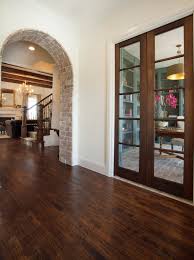 La Cantera Spanish Hacienda Exposed Brick Archway Bannister Custom Homes Brick Interior Brick Archway French Doors Interior