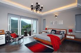 This delicate red pattern is the perfect addition to the nook, and is complemented by the bold red bed frame and bookshelf. Red Bedroom Tips And Advice