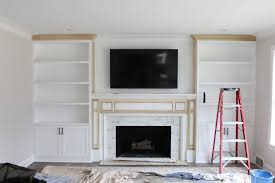 Bedroom built ins with fireplace. White Built Ins Around The Fireplace Before And After The Diy Playbook Fireplace Built Ins Built In Shelves Living Room Built In Around Fireplace