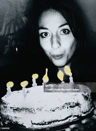 Woman Blowing Out Birthday Candles High-Res Stock Photo