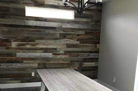 The utilization of reclaimed wood for an accent wall is a great way separate large spaces, create an extra pop in an office setting or add natural texture and color to a bedroom. How To Install A Reclaimed Barn Wood Accent Wall Mcarthur Homes