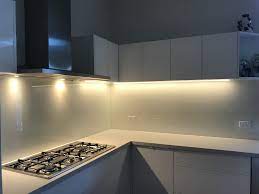 Lighting Against Glass Splashbacks Creates A Beautiful Effect Coloured Glass Splashbacks Glass Table Glass Splashback