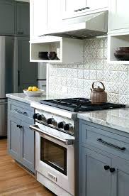Liz morrow 's small kitchen is given space and depth with white up top for the backsplash and cabinets and deep charcoal, almost black, down below. 25 Blue And Grey Kitchen Designs That Inspire Digsdigs