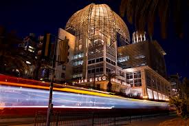 The building dome was designed to be like an open mind. San Diego Trolley In Front Of The San Diego Public Library Photograph By Nathan Rupert