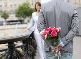 So i had a nice bouquet of sunflowers sent to her office today, with a little note to perk her day up. Man Ready To Give Flowers To Girlfriend On A Bridge Stock Photo Picture And Royalty Free Image Image 14679358
