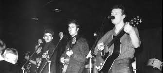 Performing with Tony Sheridan (to the right of John in both images) at Hamburg's Top Ten Club in the spring of 1961, photographed by Ellen Piel. Today in 1962, just over two
