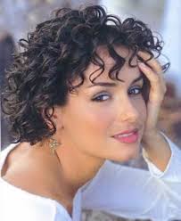 One of the prettiest elongating short hairstyles for round faces is the full curly pixie with an undercut. Gina Davis Rocking The Curly Bob On Round Face Curly Hair Styles Short Curly Hair Bob Haircut Curly