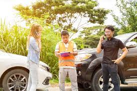 Driver in Car Accident using mobile phone with Insurance Company officer on  countryside and sun flare background. 17521309 Stock Photo at Vecteezy