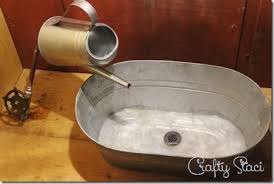 galvanized tub sink and watering can
