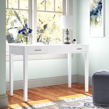 Dressing table stool with a white wood frame and faux suede seat cushion. White Vanity Tables Wayfair