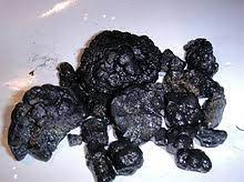 A concretion is a hard, compact mass of matter formed by the precipitation of mineral cement within the spaces between particles, and is found in sedimentary rock or soil. Manganese Nodule Wikipedia
